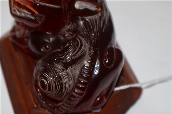 A Japanese ivory cane handle, a faux amber lion-dog and an enamel and ivory pill box